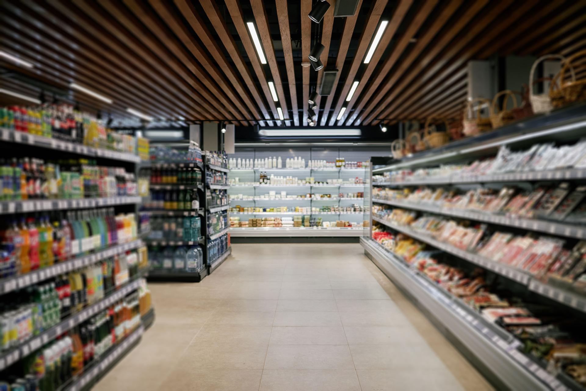 Shopping Along Shelves in Modern Supermarket Aisle